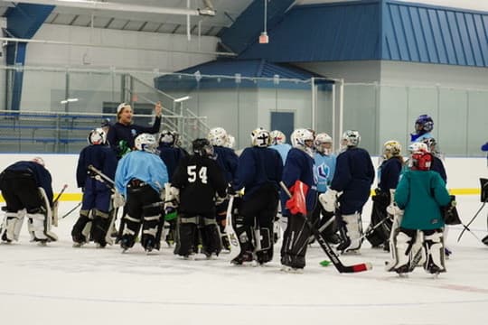 LH Goaltending camp huddle on ice
