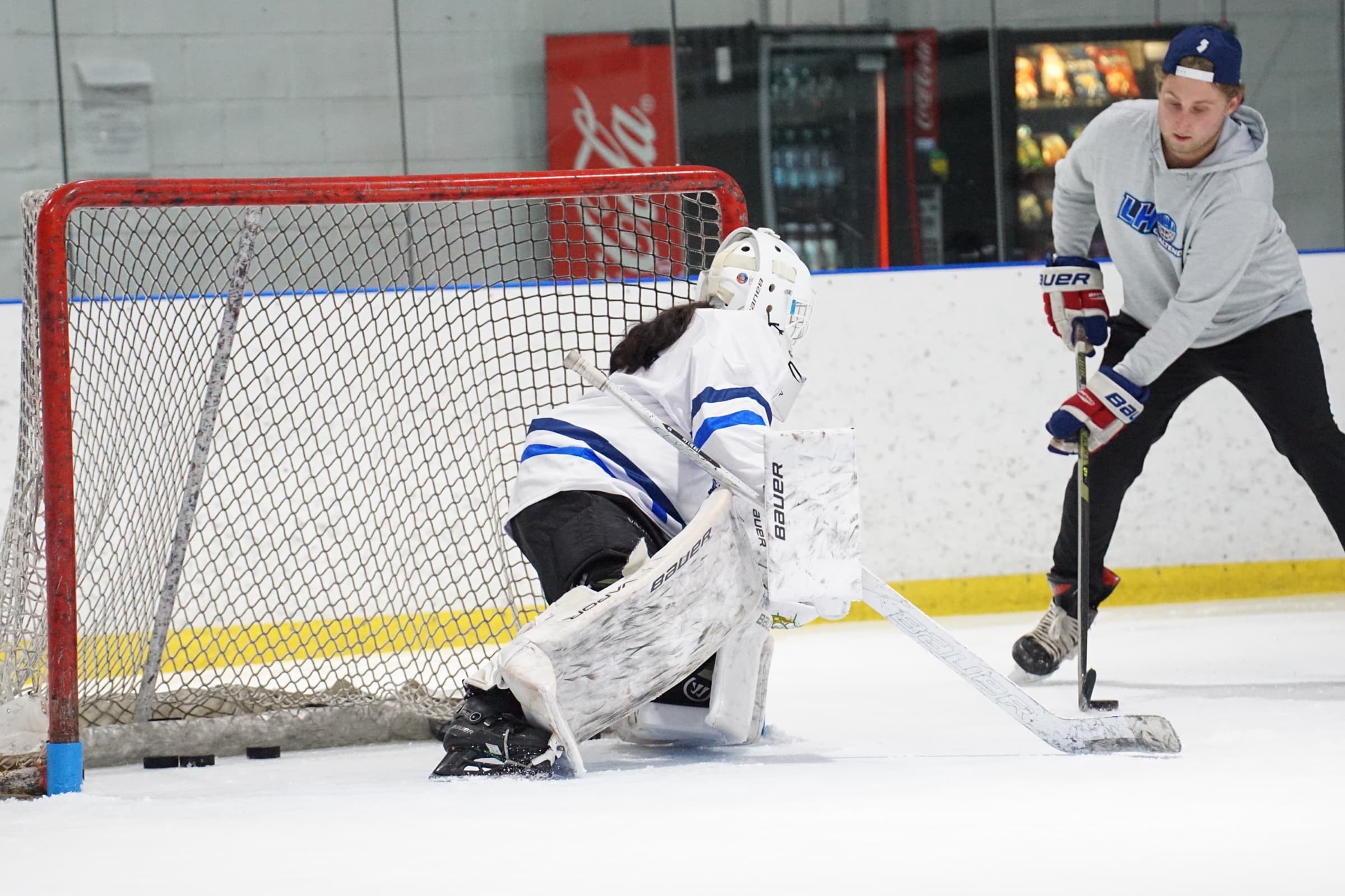 LH Goaltending goalie tracking a shot through traffic