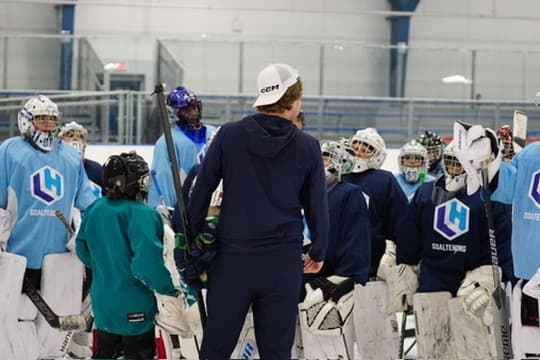 Coach Lucas breaking down play with goalies